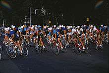 Several cyclists riding in a group