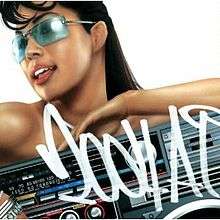 A mid-shot of Ai against a white background, where she smiles, wearing long hair and blue tinted glasses. She is not noticeably wearing clothes, however the lower half of her body is covered by a boombox. "2004 A.I." is hand-written in front of the image in white, in a graffiti-style font.