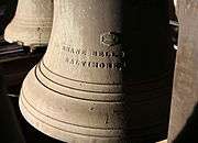 This is an image of the 8th Bell in the Highland Arts Theatre Chime, showing the inscription "MC SHANE BELL FOUNDRY CO., BALTIMORE, MD., 1911" on its waist. This bell weighs 575 lb (261 kg).