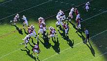 American football players during a play