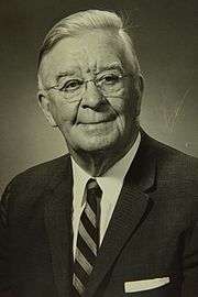 Photo of Alfred Verville in a sport coat posing for formal picture