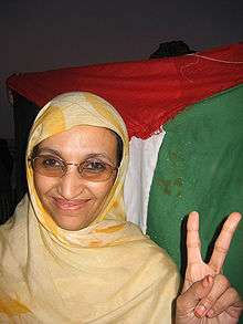 Aminatou Haidar making a "V-for-victory" sign