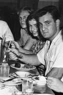 Bob Gaudio sitting at a table and eating