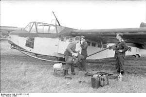 a black and white photograph of a wide-bodied military glider