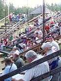 Audience sitting in the stands at Caravan Farm Theatre