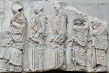 Photograph of part of the Parthenon frieze, showing five girls in profile.