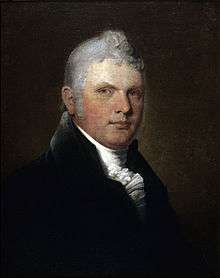 Portrait of an older man with white hair, dark jacket and white cravat in a fancy knot.