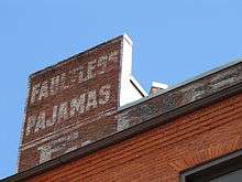 The back of the Faultless Pajama Company building, depicting painted-brick ad.