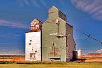 Track-side view of the same two elevators