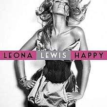 A black and white portrait of a woman. She has a long wavy hair and she is smiling, also she has her hands on her waist. She wears a cocktail dress and many bracelets on her right wrist. In front of her image the words "Leona" and "Happy" are written in black capital letters and inside a purple box, while "Lewis" is in white capital letters appearing in a silver box.