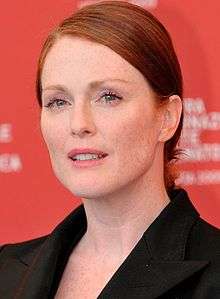 A photograph of Julianne Moore attending the Venice International Film Festival in 2009