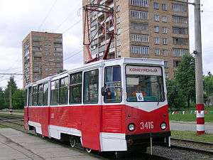 Red-and-white tram on a city street