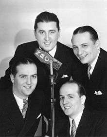 The Landt Trio and White stand around an NBC microphone about 1936.