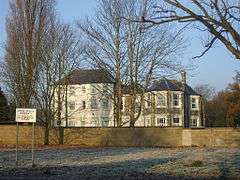 Latchmere House from Latchmere Lane. A sign states: "Home Office Property. No ball games, dogs or horses please".