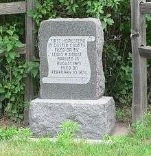Stone monument, 2-3 feet high, inscribed "First homestead in Custer County, filed on by Lewis R. Dowse, arrived in August 1873, filed on February 10, 1874