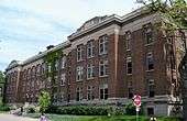 An exterior shot of a brown, brick building