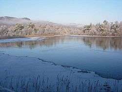 View of the partly frozen loch in winter, looking toward the inlet burn