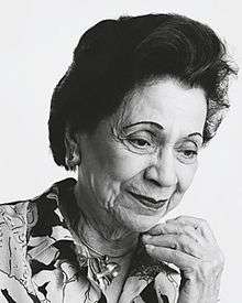 Black and white portrait of a woman in white background