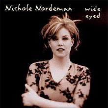A dark sepia-tinted image of a blonde haired woman with her hands crossed in a black background, above her the words "Nichole Nordeman" and "Wide Eyed" are printed in a stylized typeface.