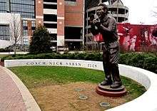 Bronze statue outside a stadium.