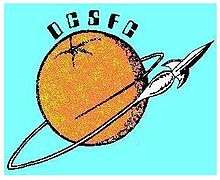 An orange orbited by a rocket as if it were a planet