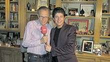Raffi Boghosian poses with Larry King in King's home.
