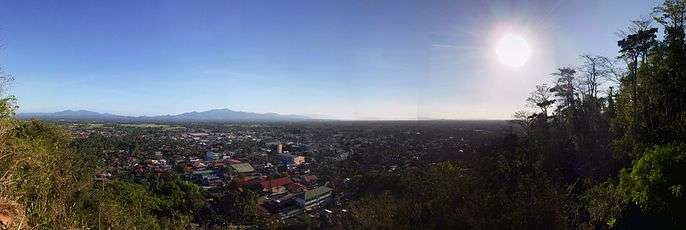 Rosario, Batangas skyline with the downtown on the foreground and rice fields (where Rosario is known for) and mountains on the background.