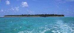 Photograph of the small, coral atoll of the island of Satawal in the Pacific Ocean.