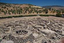 Foundations of former circular buildings.