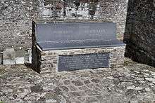 A stone seat outside a church