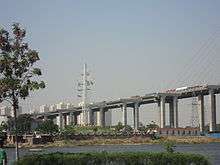 a white slat semaphore tower on an island