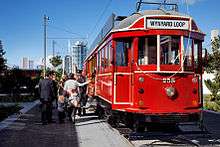 A red tram with the destination sign reading Wynyard Loop