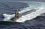 Submarine executing a tight turn on surface, leaving behind a huge wake.