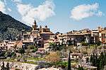 A mountain village with a church.