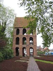 alt The belltower for Westerstede's St. Peters Church is housed in its own building next to the church.