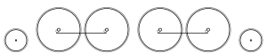 Diagram of one small leading wheel, four large driving wheels in two pairs, each pair joined by coupling rods, and one small trailing wheel