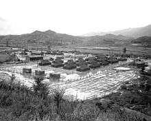 A camp surrounded by foliage