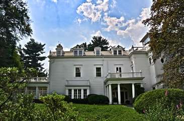 Part of a two-story white house